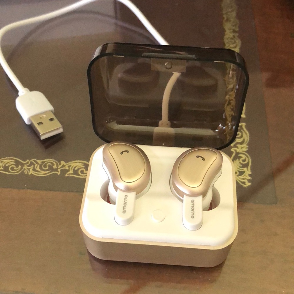 - Blue tooth ear buds. Rose gold. Like new. In case with charge cable.
